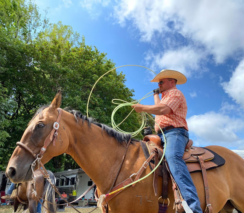 Cowboy making a lasso with rope